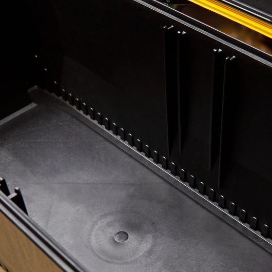 Photo of STANLEY 028001L toolbox interior with black plastic dividers and smooth bottom surface.