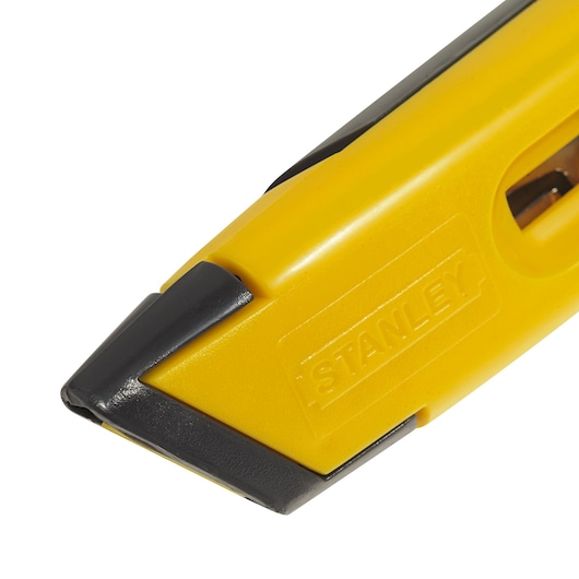 Stanley 10-065LA utility knife close-up, yellow and black handle, angled left on white background.