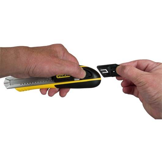 Photo of STANLEY 10-481 utility knife with hands showing blade changing feature, side angle, yellow and black handle.