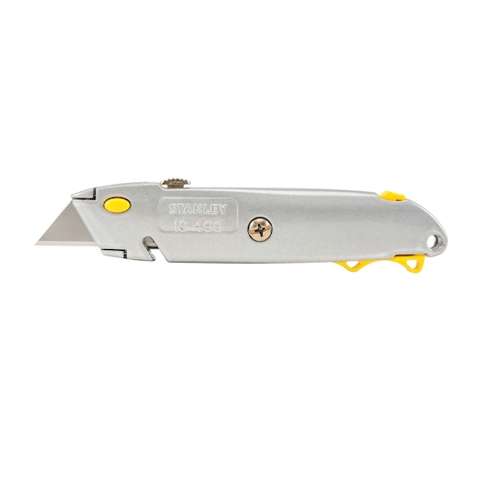 Stanley utility knife side view, silver metal body with yellow accents, exposed blade, white background