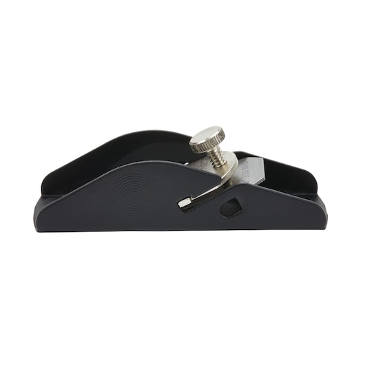 STANLEY block plane side view on white background, showing black metal body and silver adjustment knob