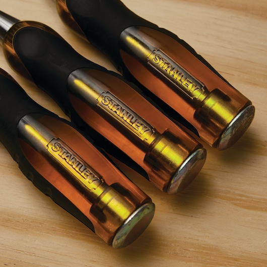 Photo of STANLEY 16-970 screwdriver handles with translucent amber and black design on wood surface.