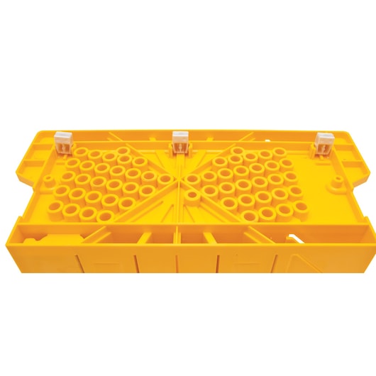 Stanley yellow plastic photography accessory tray, top view, with multiple circular slots and three white clips