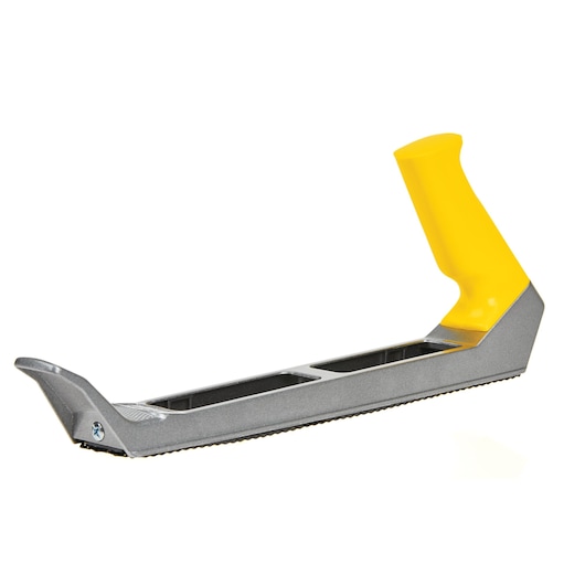Stanley surform plane with yellow handle, angled side view on white background