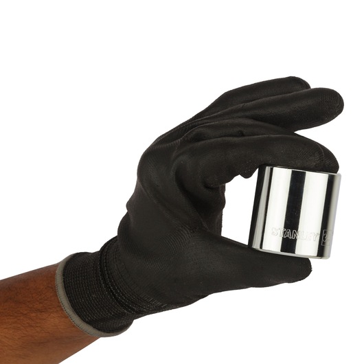 Photo of STANLEY 4-86-196 chrome socket held by a hand in a black glove, product side view.