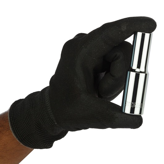 STANLEY 4-86-420 chrome socket held by a gloved hand, close-up, product photography.