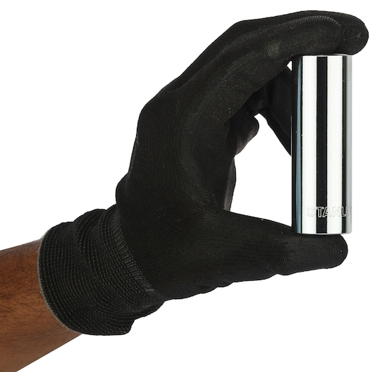 Photo of STANLEY 4-86-427 chrome socket held by a hand in black glove, front angle.
