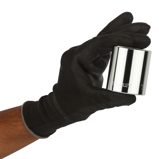 Photo of a gloved hand holding a STANLEY 4-86-536 large chrome socket, product photography on white background.