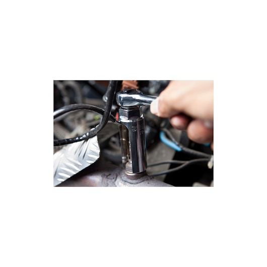 STANLEY 78-209 socket wrench being used to tighten a bolt on machinery, close-up view.