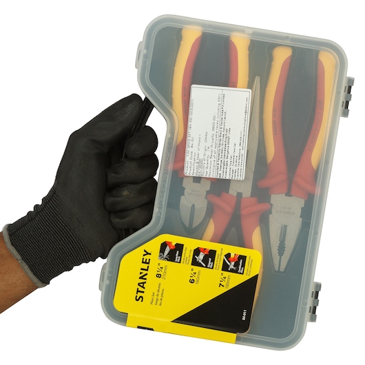 STANLEY 84-011 pliers set in clear plastic case with yellow label, hand holding case, front angle.