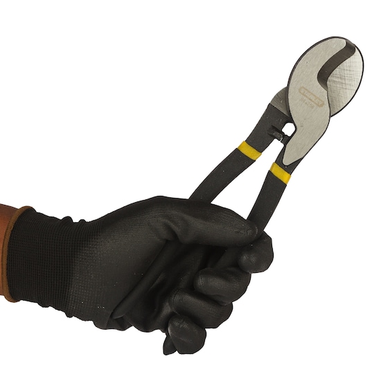 STANLEY 84-258LA cable cutter pliers held in gloved hand, side angle.
