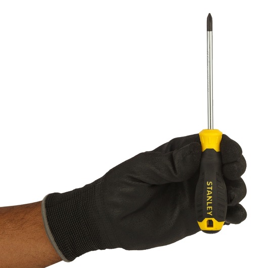 Photo of STANLEY STMT60805-8 Phillips screwdriver with yellow and black handle held by gloved hand.