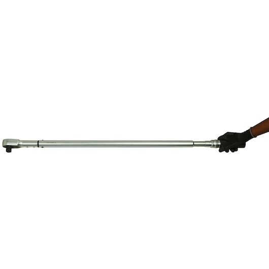 STANLEY STMT73592 torque wrench, photography, silver, side view, held by a gloved hand against white background.