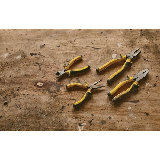 STANLEY 84-054LA pliers set with yellow handles on a rustic wooden surface, product top view